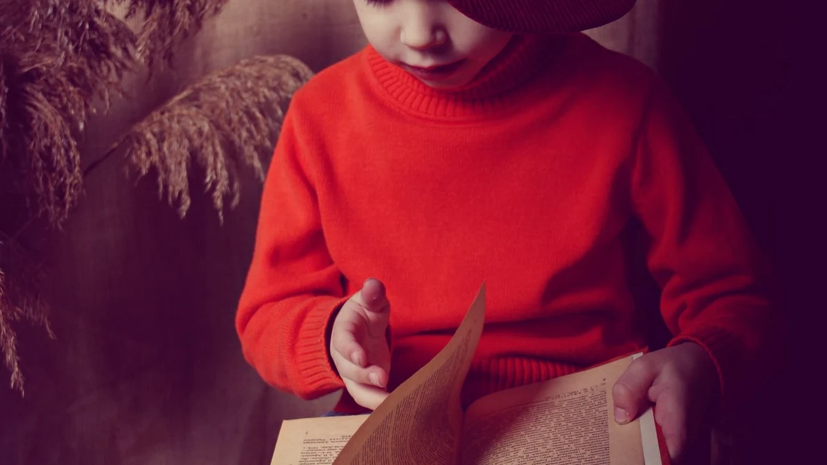 Child reading a book at home, part of a daily AISSEE GK routine