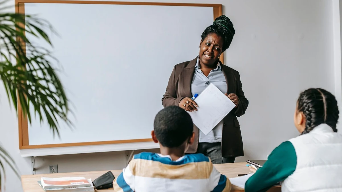 A teacher explaining a lesson to students in a classroom