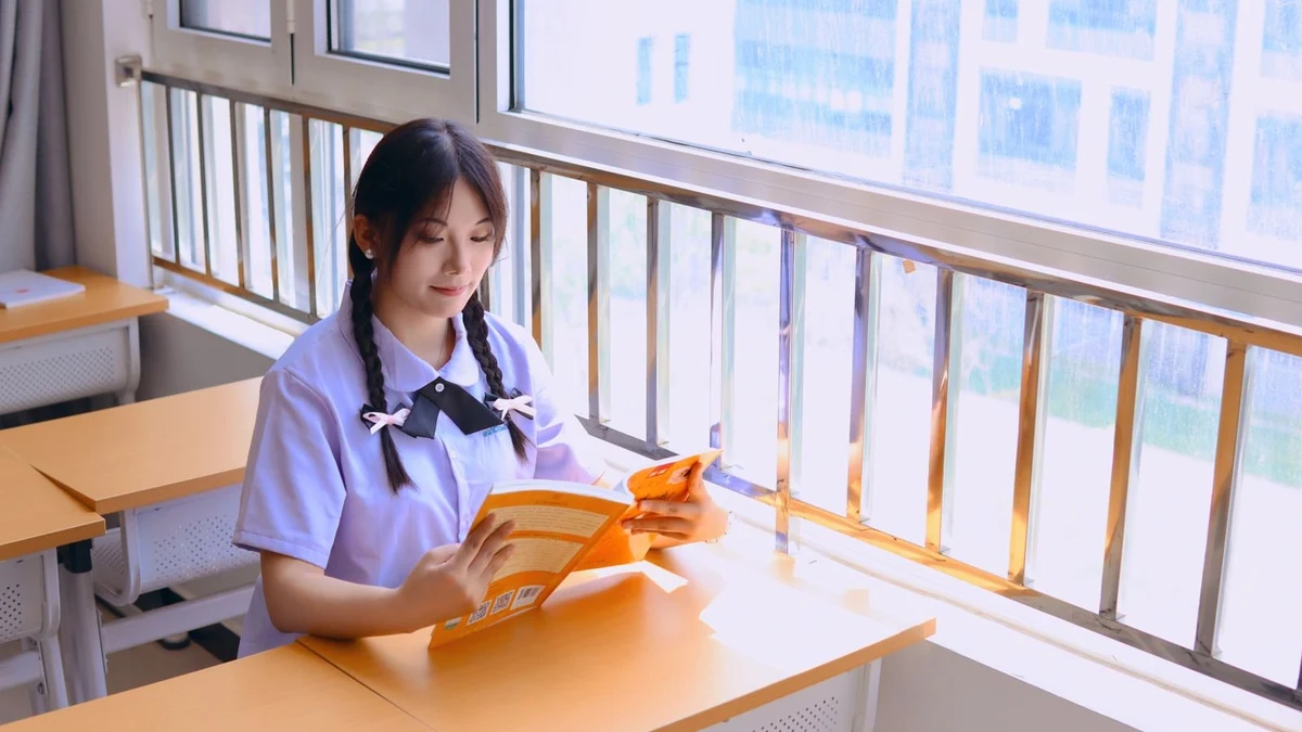 A child studying at home with healthy food nearby